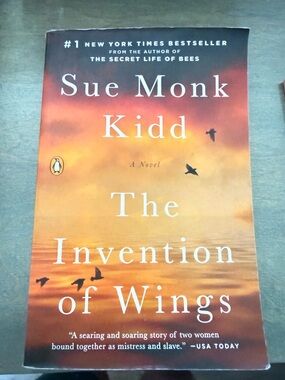 Sue Monk Kidd "The Invention of Wings" - Penguin Paperback, Sunset Orange Cover